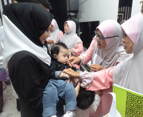 Naming ceremony in Seremban, Malaysia 